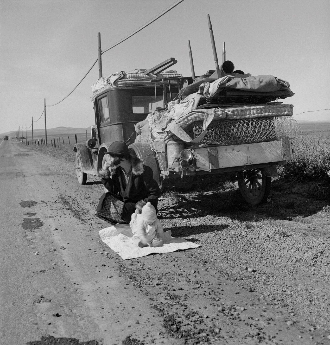 Dorothea Lange's photo of a Missouri migrant family's jalopy stuck near Tracy, California 